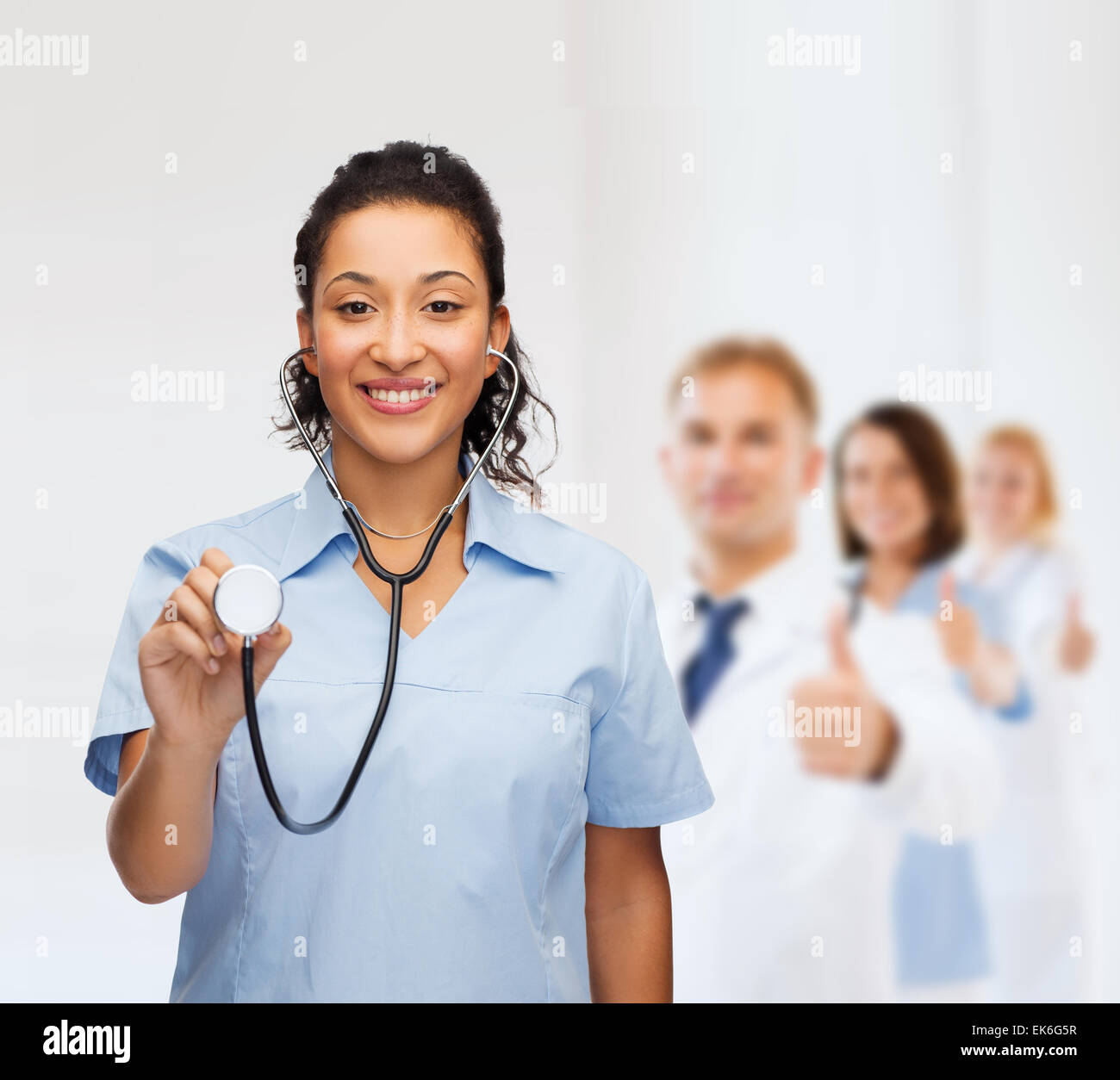 smiling female african american doctor or nurse Stock Photo - Alamy