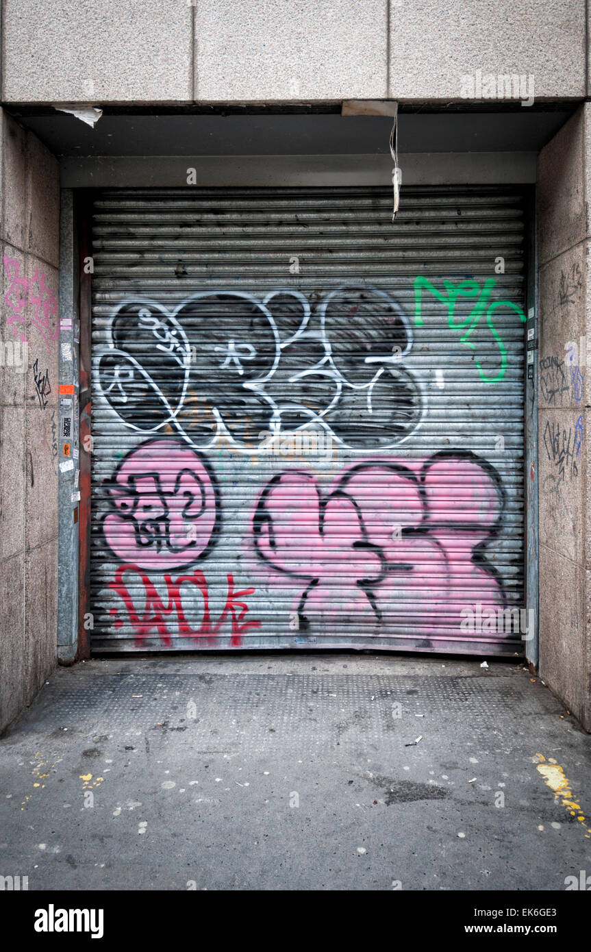 roller metal doors with graffiti, loading bay. Stock Photo