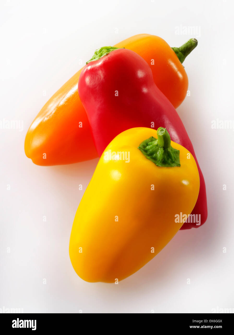 Mixed whole fresh red, orange & yellow baby sweet bell peppers Stock Photo Alamy