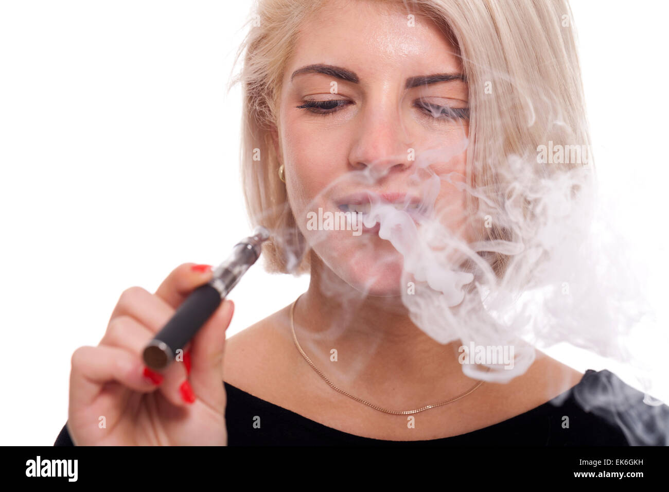 Close up Serious Facial Expression of a Young Blond Woman Smoking Using E- Cigarette on a White Background Stock Photo