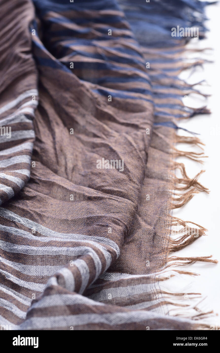 Frayed threads on the edge of a womans scarf Stock Photo