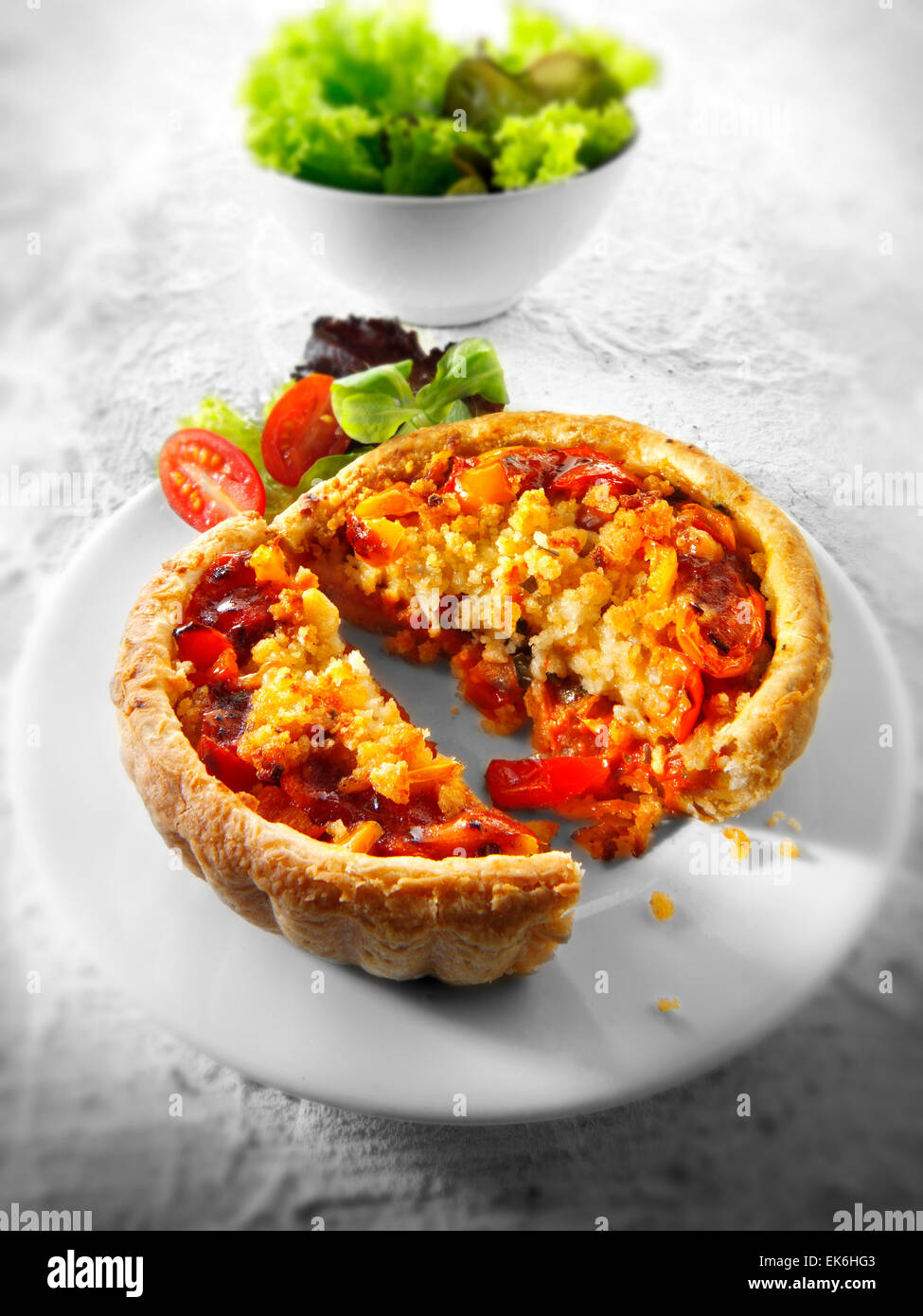 Cooked tomato & pepper pastry tartine cut and plated Stock Photo