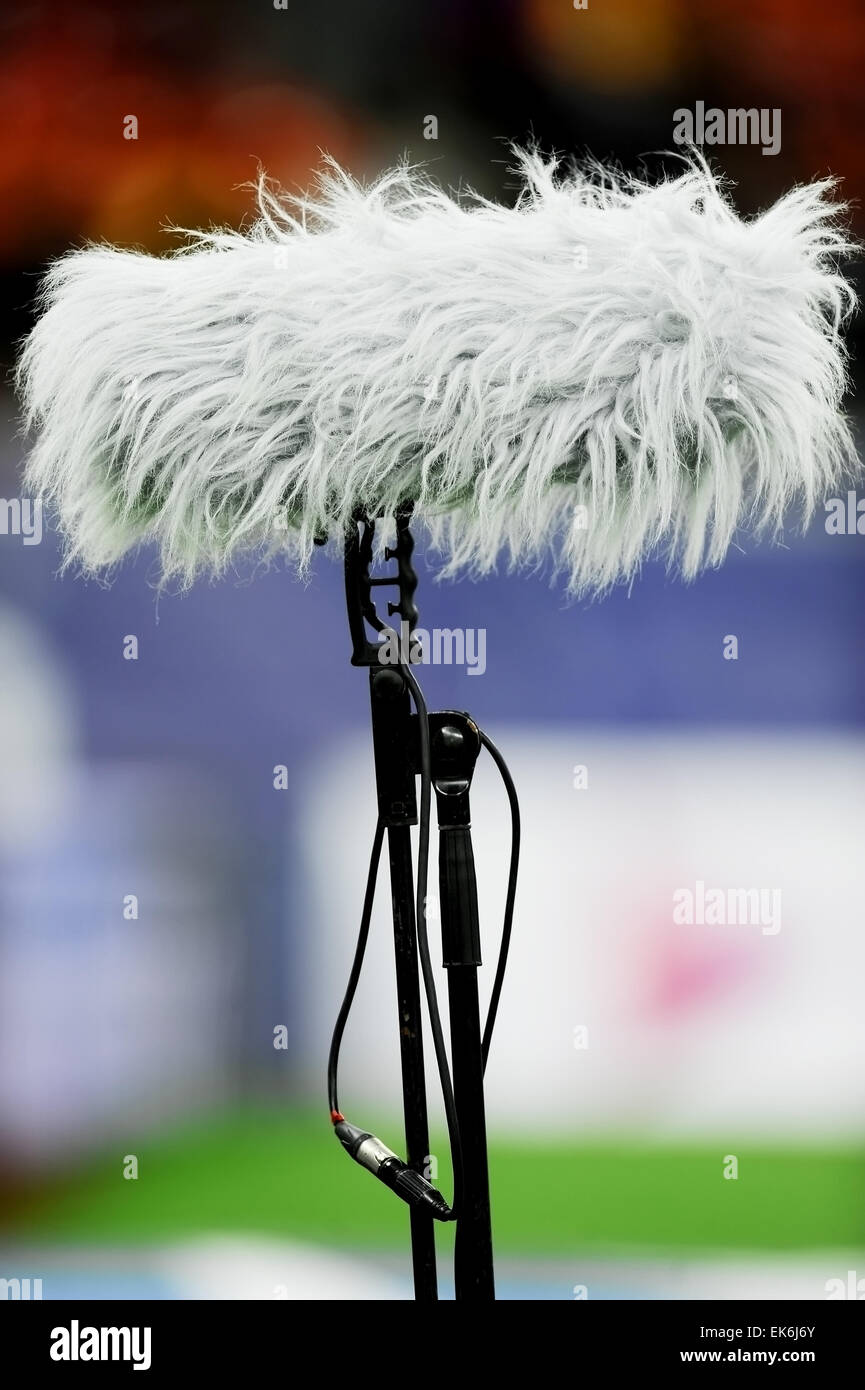 Big and furry professional sport microphone on sport field Stock Photo