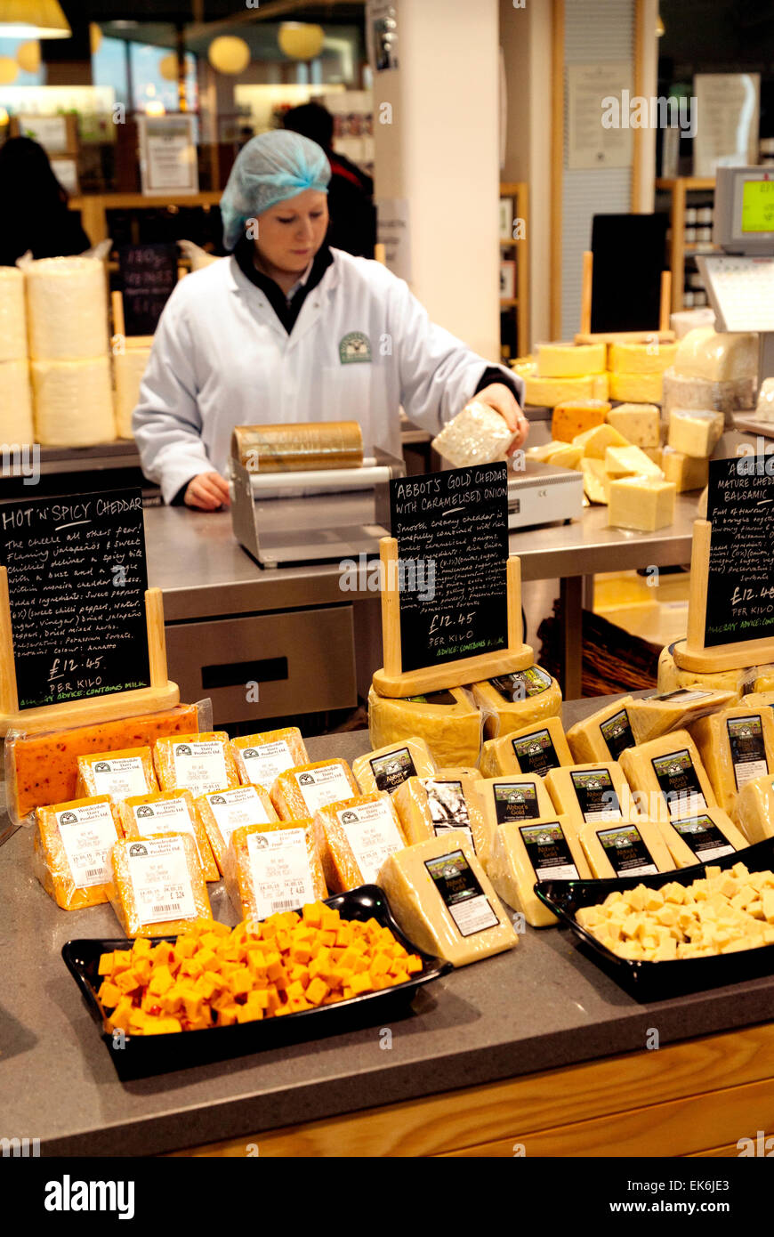 Staff selling cheeses in the cheese shop, Wensleydale Creamery, Hawes