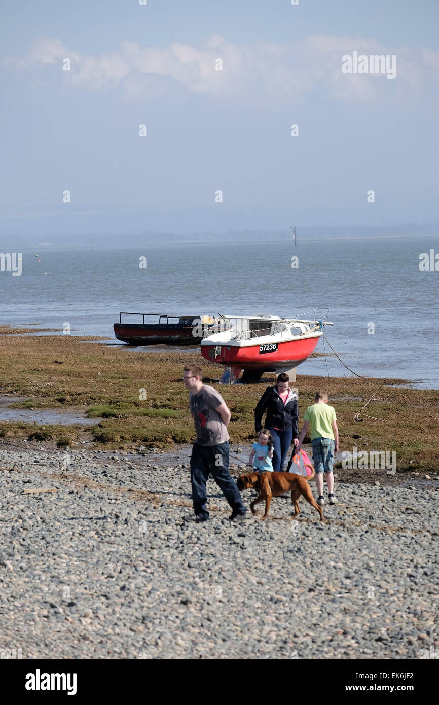 Family walking along the shore at Lytham in Lancashire Stock Photo