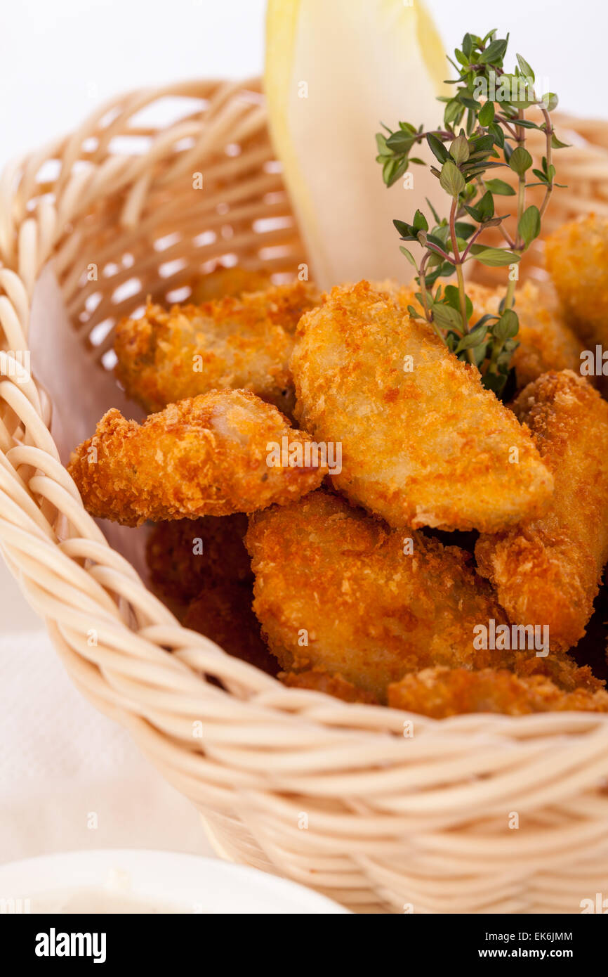 Crisp crunchy golden chicken legs and wings deep fried in bread crumbs