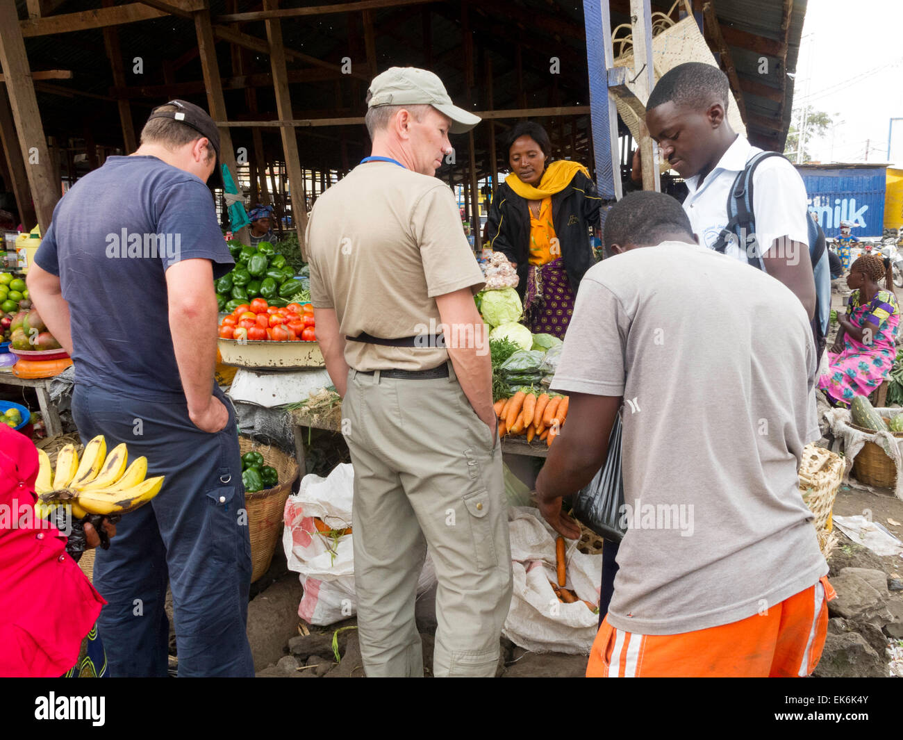 Western workers and local people shopping at the local market, Goma, Democratic republic of Congo ( DRC ), Africa Stock Photo