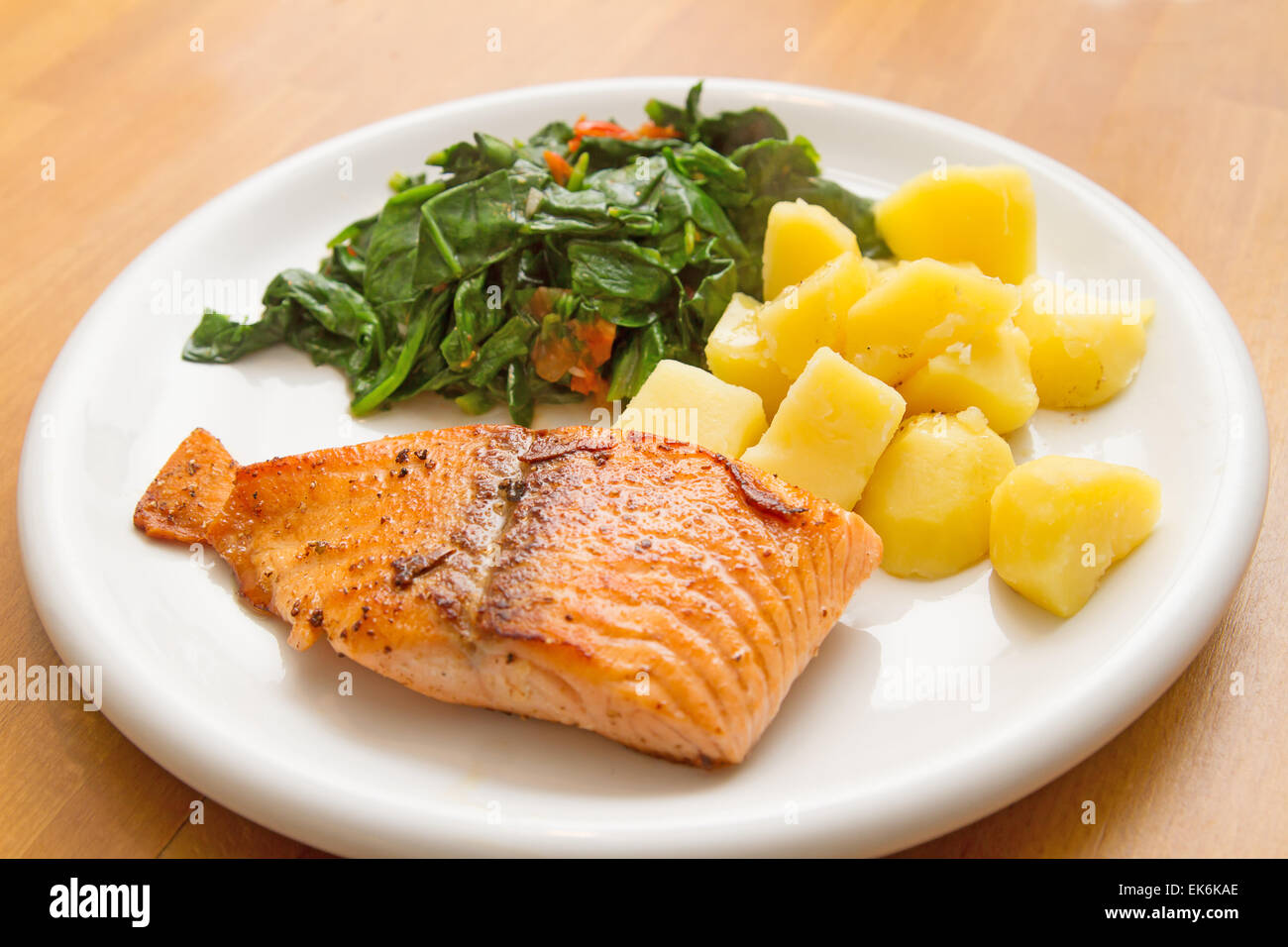 Salmon fillet with spinach Stock Photo