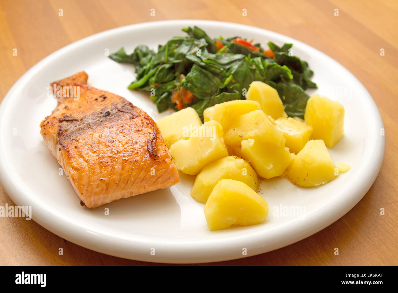 Salmon fillet with spinach Stock Photo