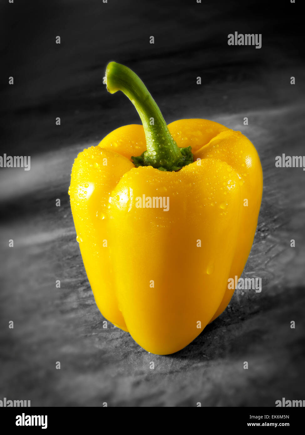Close up of a whole fresh yellow bell pepper ( capsicum ) Stock Photo