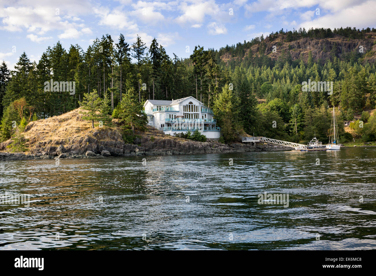 North America, Canada, British Columbia, Quadra Island, Discovery Passage, house beside ocean Stock Photo