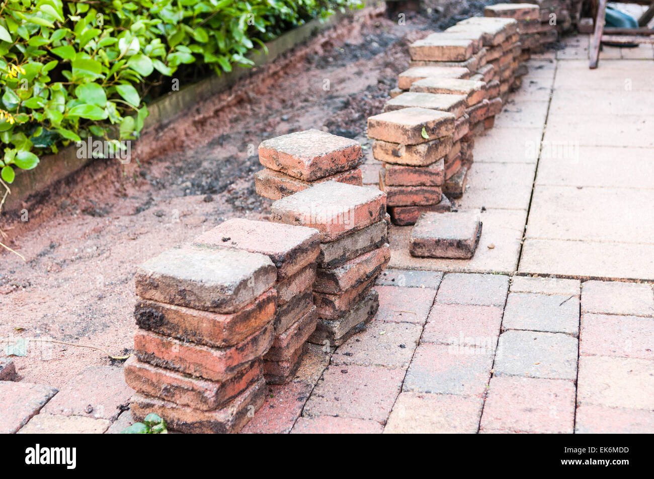 Patio bricks lifted to allow a repair Stock Photo