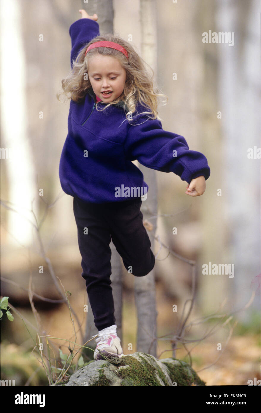 child balancing on a rock Stock Photo - Alamy