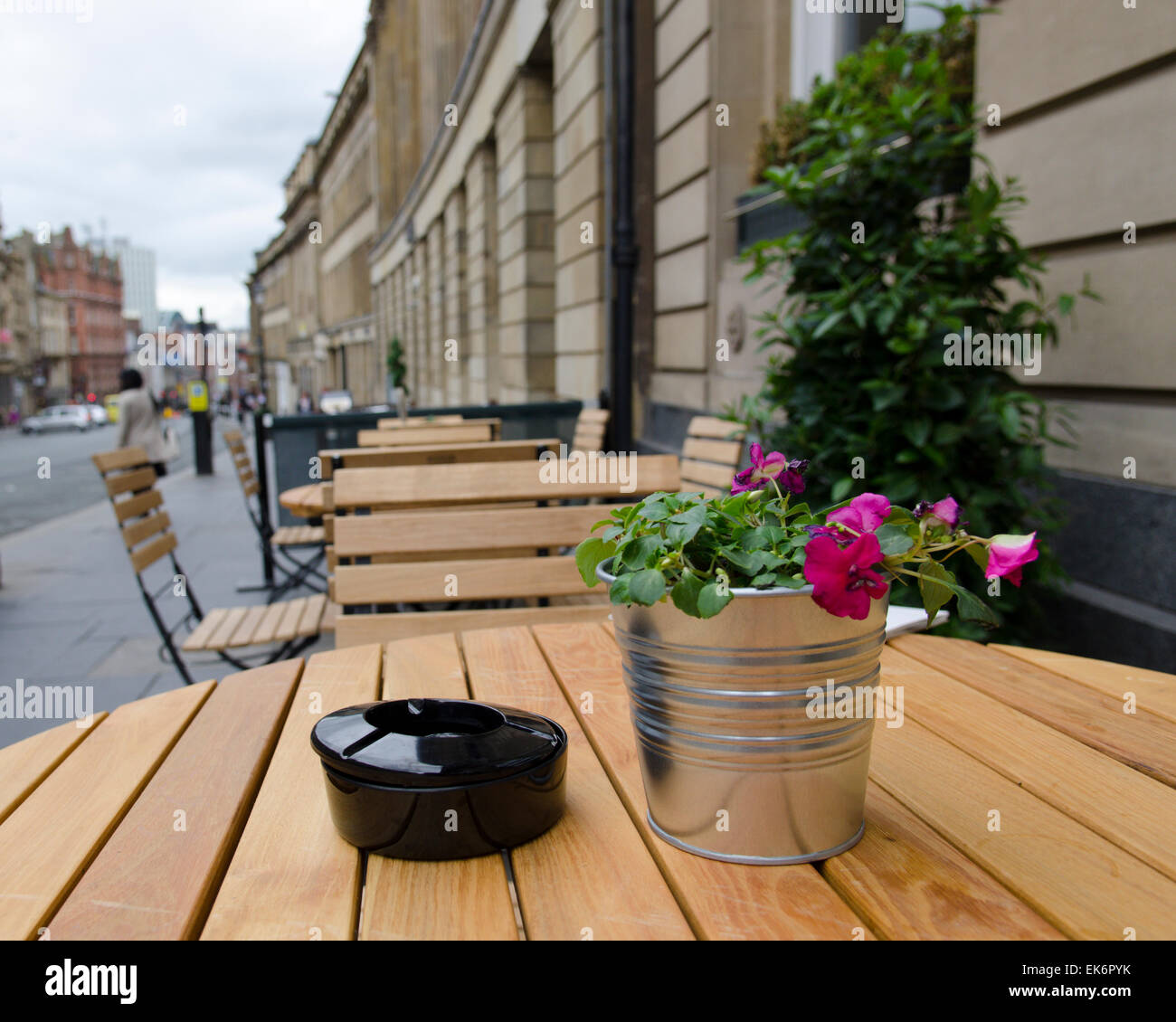 Table and Chairs with flowers outside cafe in Grey Street, Newcastle