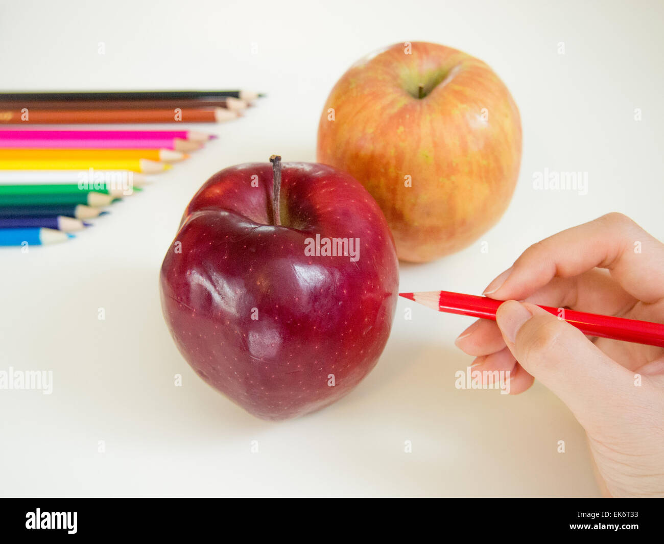 looks like drawing apples with the colored pencil Stock Photo
