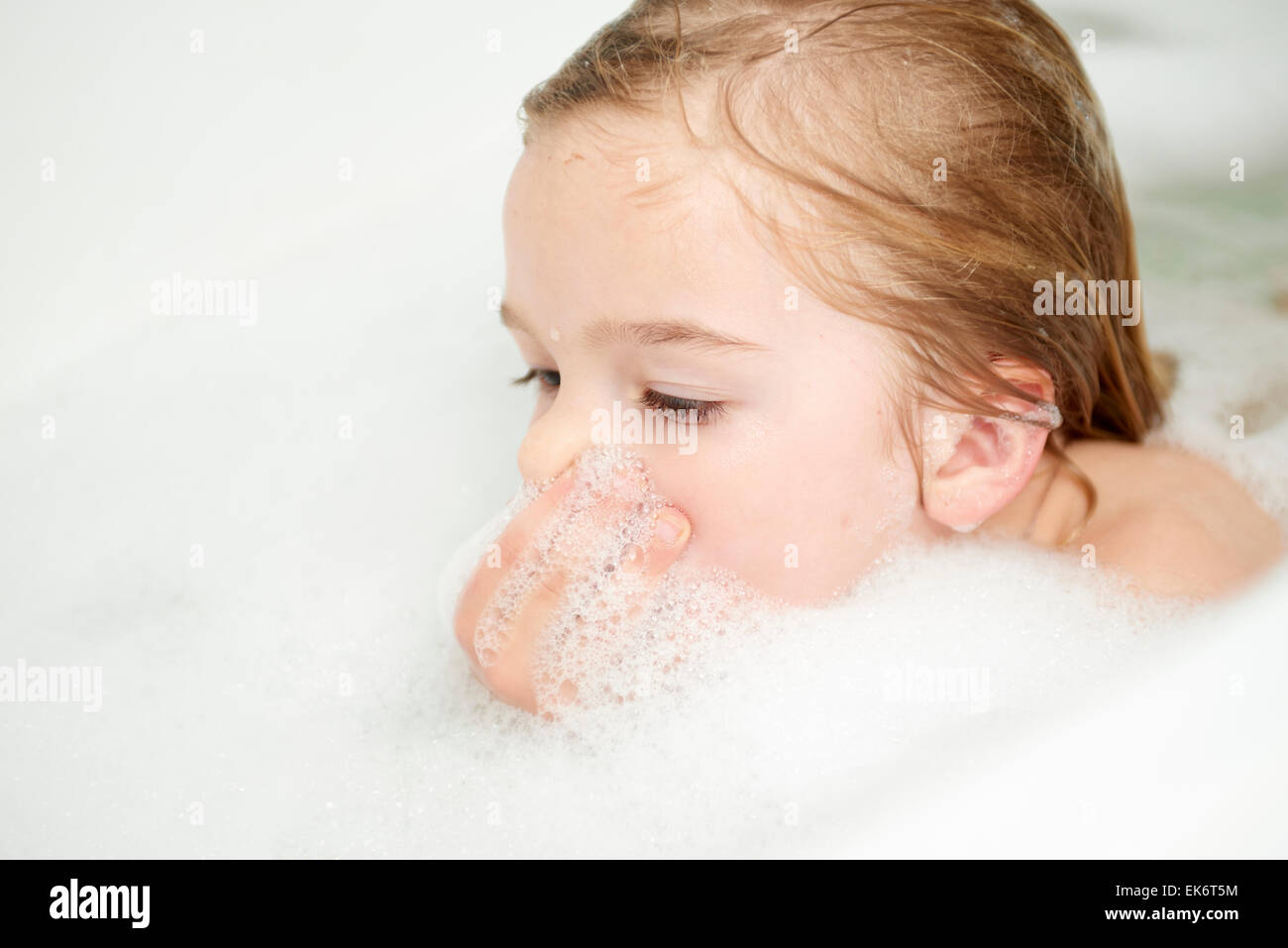 Smiling Child Girl in Bathtub Stock Photo - Alamy