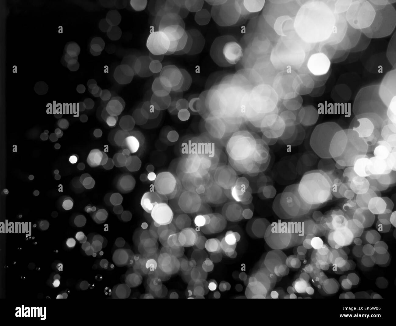 Stylized snow or rain drops glitter. Abstract circular bokeh background of Christmaslight Stock Photo