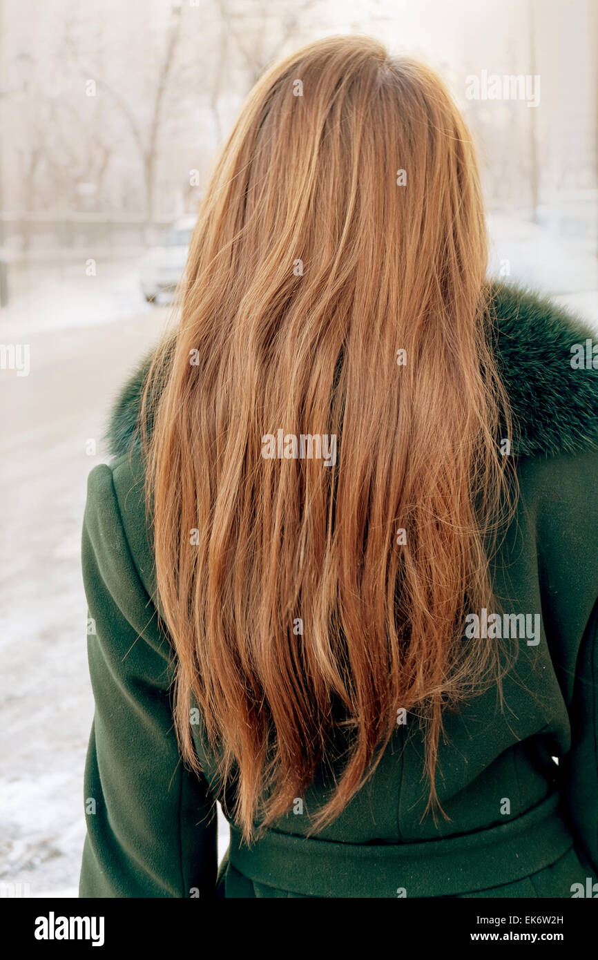 Rear view of a casual young blond standing outdoors in the stree Stock ...