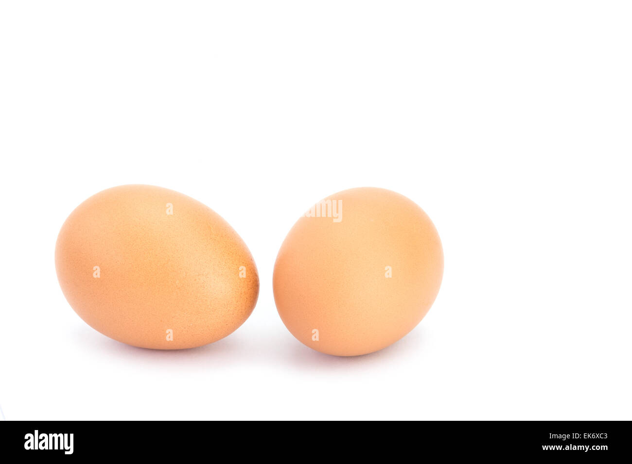 Close up two eggs isolated on white background Stock Photo - Alamy