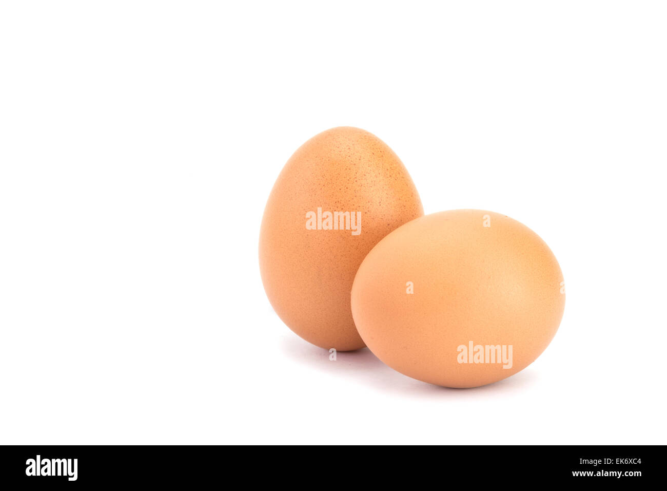 Close up two eggs isolated on white background Stock Photo - Alamy