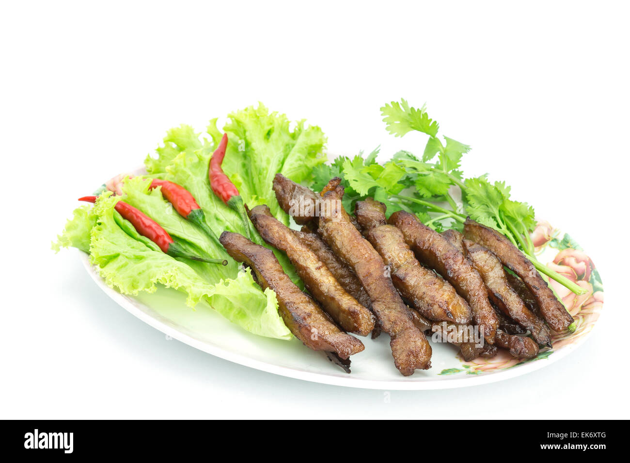 Fried pork, Thai food served with vegetable isolated on white background Stock Photo