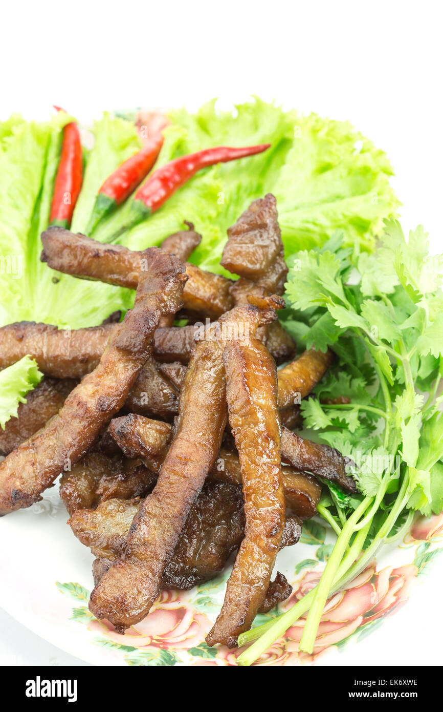 Fried pork, Thai food served with vegetable isolated on white background Stock Photo