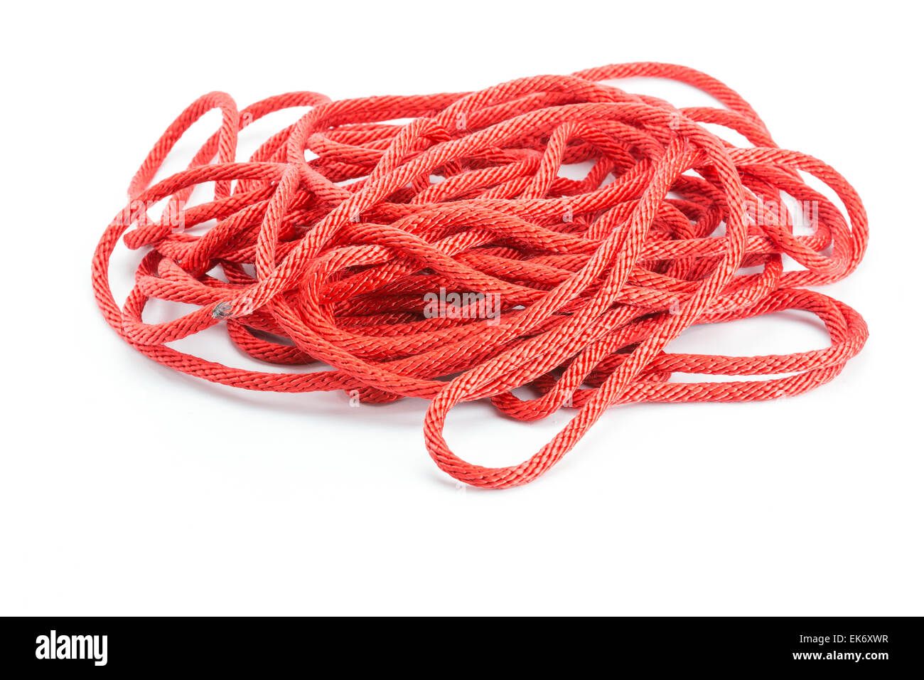 Tangled pile of red yarn with a single piece leading out, isolated on white  Stock Photo - Alamy
