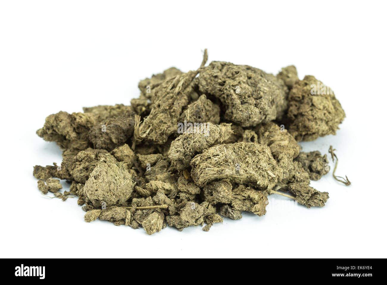 Pile of dry cow manure isolated on white background Stock Photo