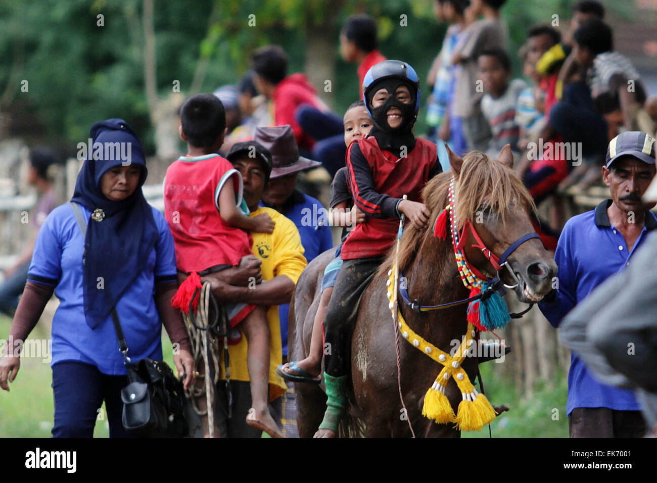 West Nusa Tenggara, Indonesia. 7th Apr, 2015. People attend the Mount Tambora Festival in Dompu, West Nusa Tenggara, Indonesia, April 7, 2015. Children horse race is a part of the Mount Tambora Festival marking the 200th year of its eruption, which is held from April 5 to April 11. The 1815 explosion of Mount Tambora buried the inhabitants of Sumbawa Island under searing ash, gas and rock, killing an estimated 88,000 people. Credit:  Dwi Aqilasya/Xinhua/Alamy Live News Stock Photo