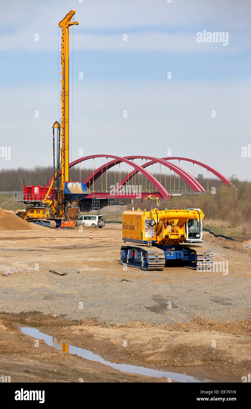 Leipzig, Germany. 07th Apr, 2015. A vibrating device works at the construction site of the future Harth canal between Lakes Conspudener and Zwenkauer near Leipzig, Germany, 07 April 2015. Mining site redevelopers LMBV use vibro compaction to densify the ground for the future canal. Overall, five vibrating devices on a total area of 70.000 square meters should bring about 14,000 so-called vibrated stone columns to a maximum depth of 25 meters. The work takes place at all hours and will continue until November 2015. Both of the lakes are 700m apart. Photo: Jan Woitas/dpa/Alamy Live News Stock Photo