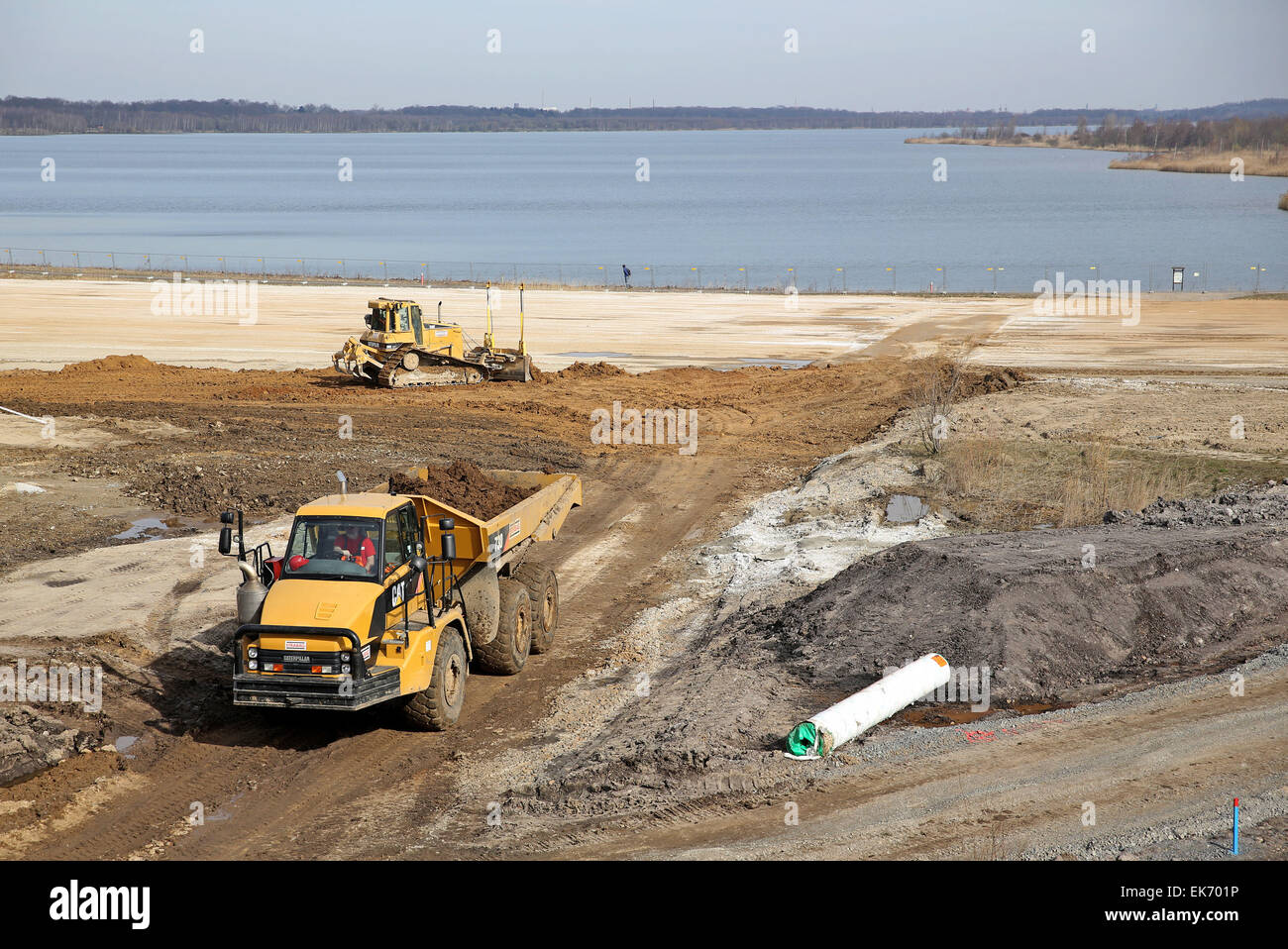 Leipzig, Germany. 07th Apr, 2015. Workers prepare the construction site of the future Harth canal between Lakes Conspudener and Zwenkauer near Leipzig, Germany, 07 April 2015. Mining site redevelopers LMBV use vibro compaction to densify the ground for the future canal. Overall, five vibrating devices on a total area of 70.000 square meters should bring about 14,000 so-called vibrated stone columns to a maximum depth of 25 meters. The work takes place at all hours and will continue until November 2015. Both of the lakes are 700m apart. Photo: Jan Woitas/dpa/Alamy Live News Stock Photo
