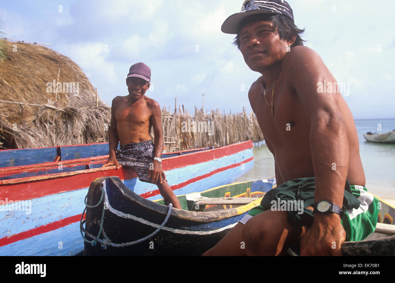 Dugout conoes and other small boats are the primary means of transportation for the Kuna Indians of Panama's San Blas Islands. Stock Photo