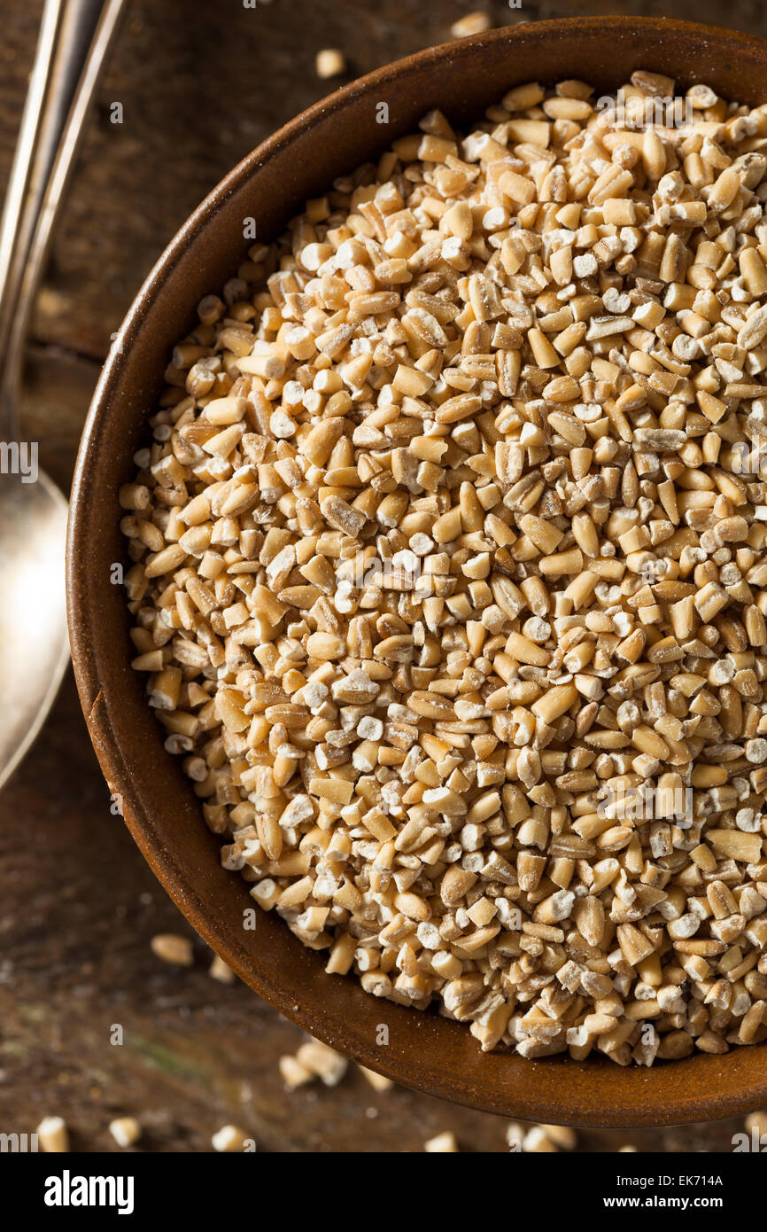 Raw Organic Steel Cut Oats in a Bowl Stock Photo