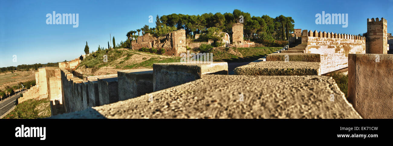 Battlements, pathways and towers of Badajoz muslim wall. Adarve and inside buildings. HDR Stock Photo