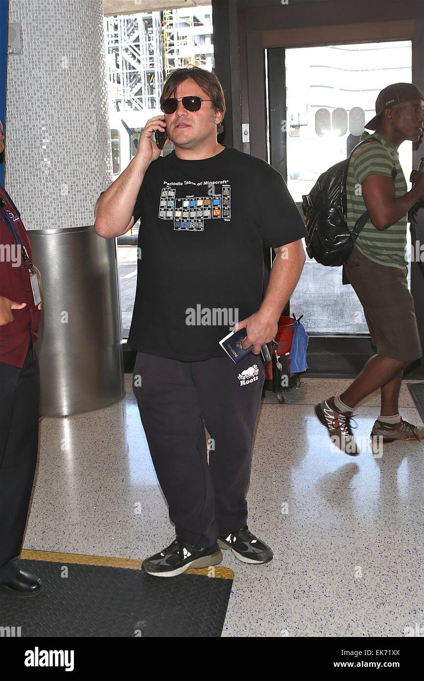 Jack Black pretends to be on phone like paris hilton as he departs LAX Featuring: Jack Black Where: Los Angeles, California, United States When: 04 Oct 2014 Stock Photo