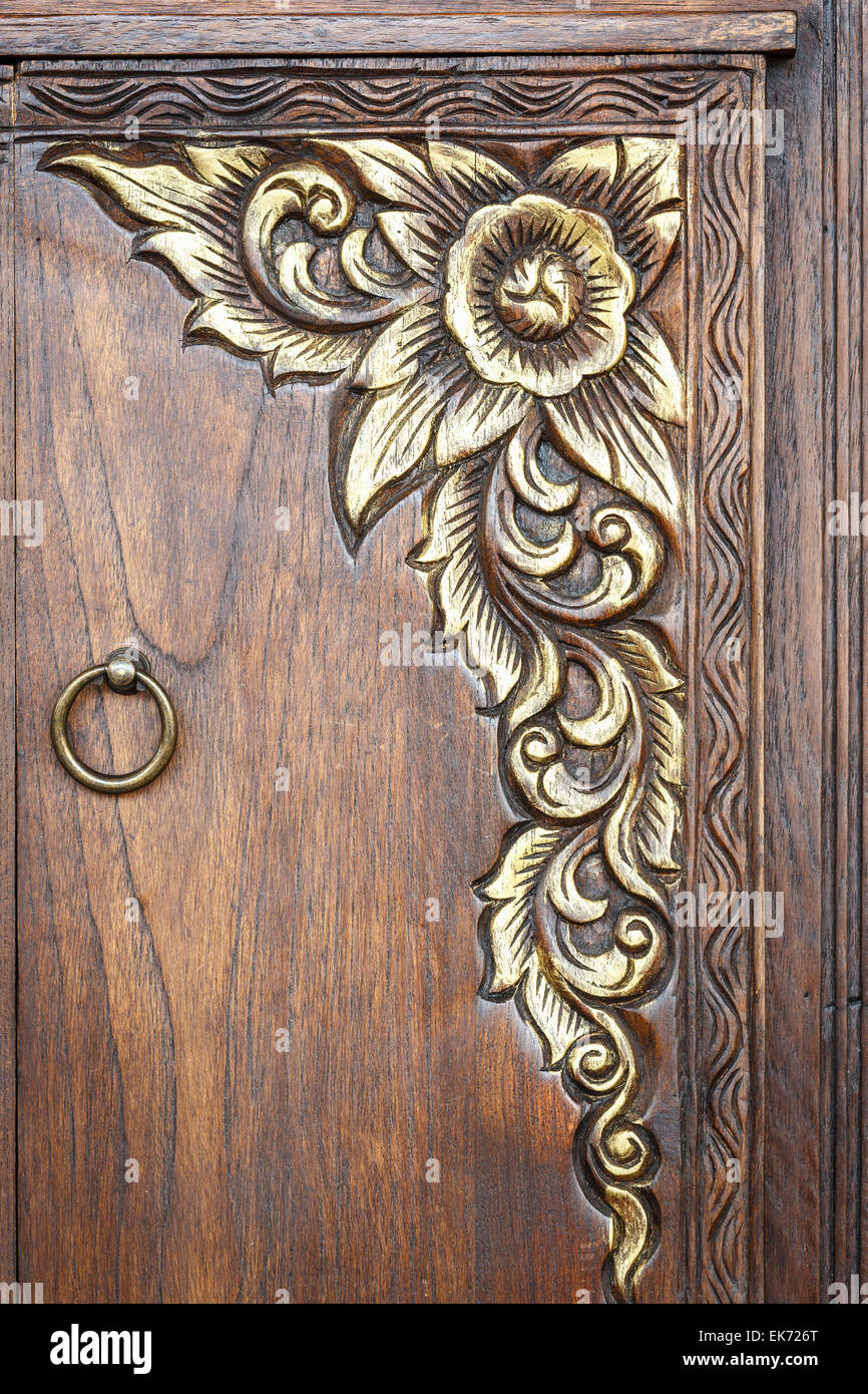 Traditional Thai style wooden door carving texture background Stock Photo