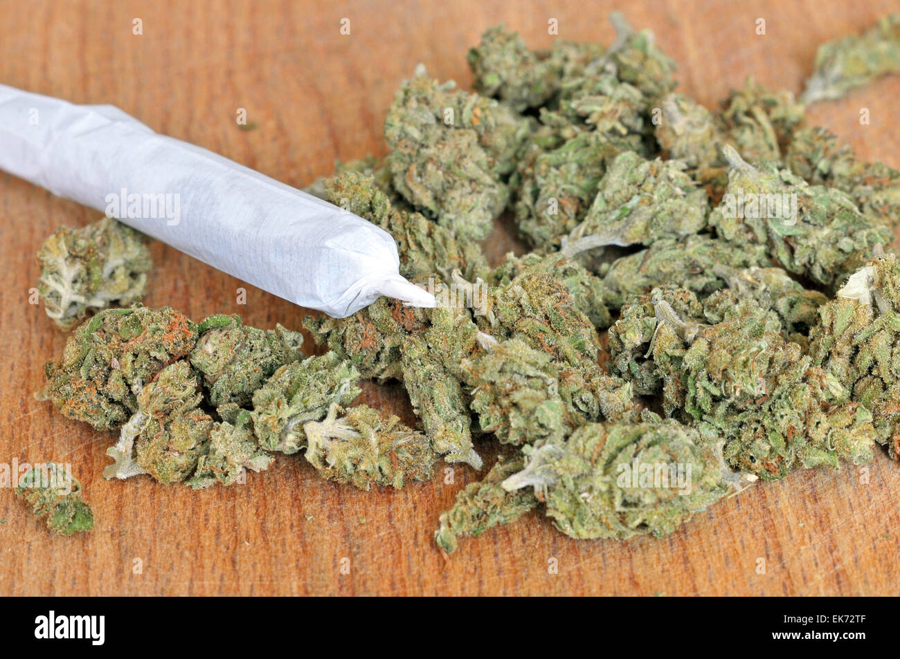 Dry marijuana buds with joint Stock Photo