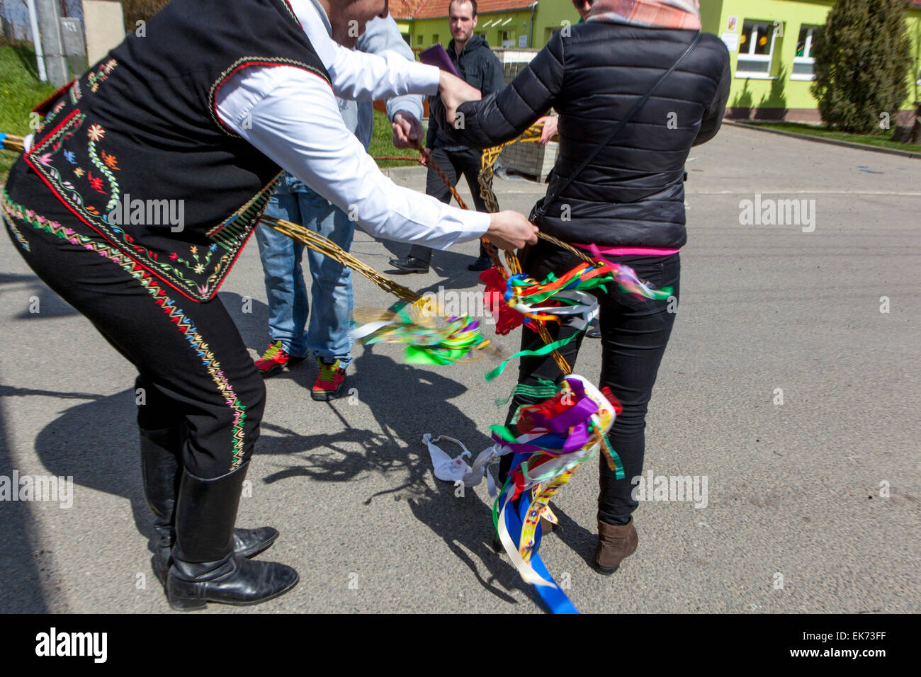 Easter Monday young boys passes through the village with a whip and