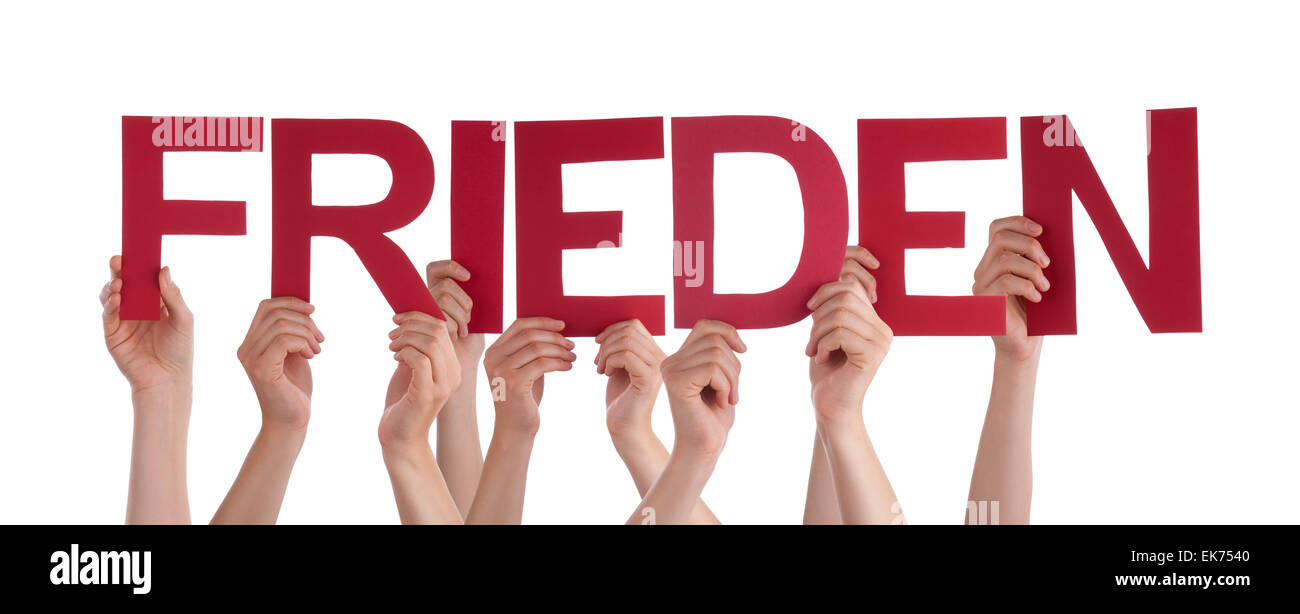 Many Caucasian People And Hands Holding Red Straight Letters Or Characters Building The Isolated German Word Frieden Means Peace Stock Photo