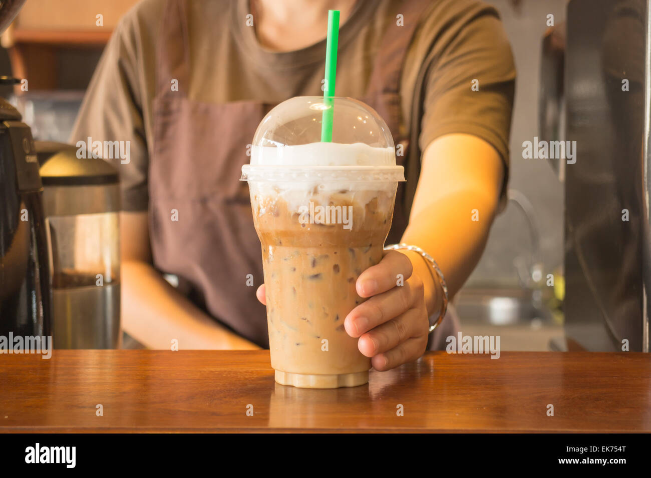Plastic glass of iced coffee cappuccino Stock Photo - Alamy