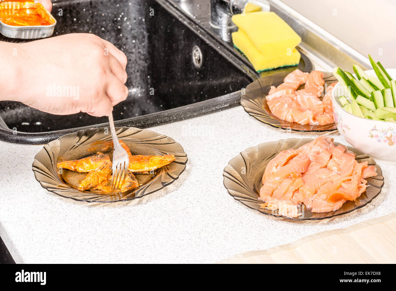 Hands cooking sushi with rice, salmon and nori Stock Photo Alamy