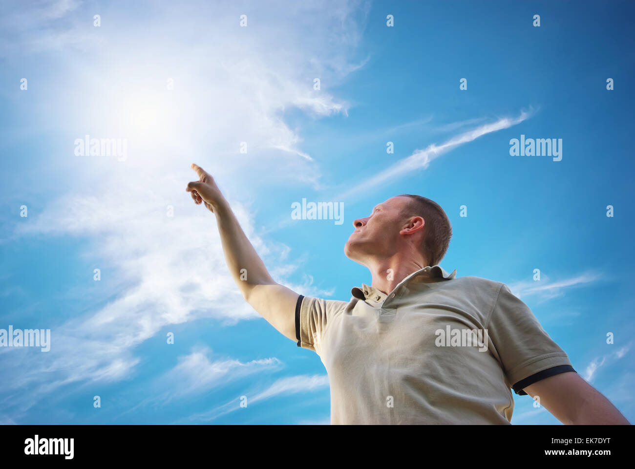 Man touch the sun. Conceptual scene Stock Photo - Alamy