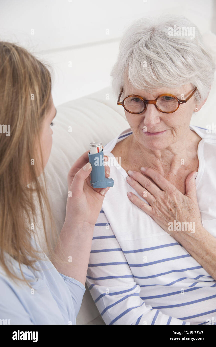 Asthma treatment senior Stock Photo