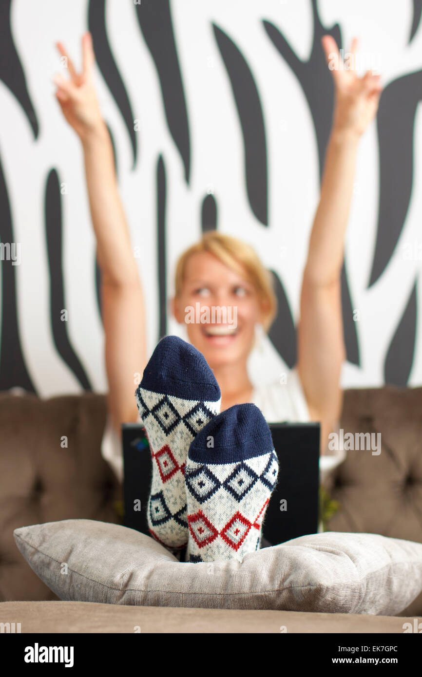Joyful beautiful young girl using laptop Stock Photo - Alamy
