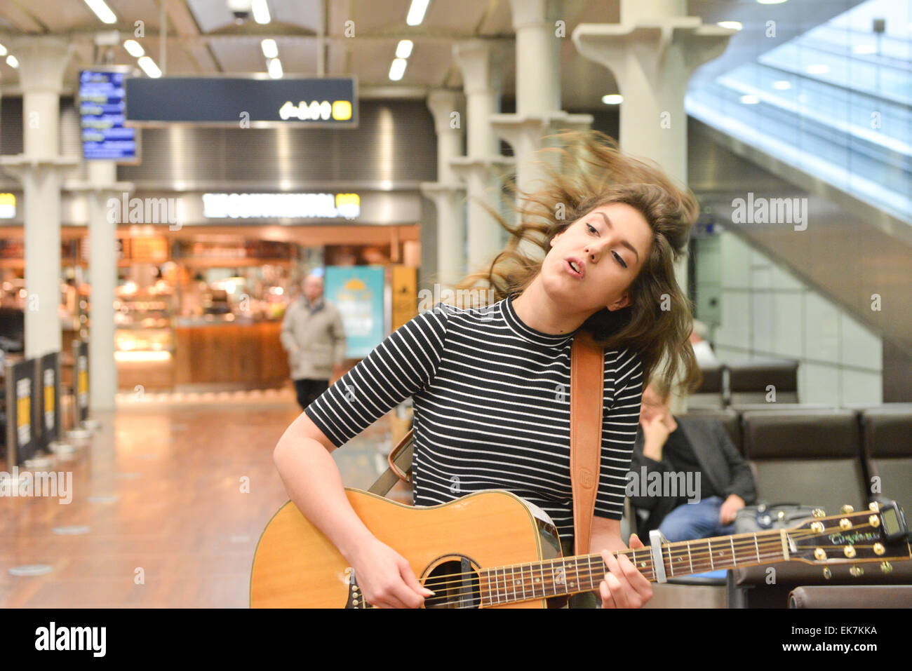 St Pancras International, London, UK. 8th April 2015. Enfield 16 yr old Natalie Shay a student at the BRIT school boards the Eurostar to busk in Paris for the day. She was awarded the Eurostar prize as well as the Youth Category in last years Gigs Busking competition organised by City Hall. Credit:  Matthew Chattle/Alamy Live News Stock Photo