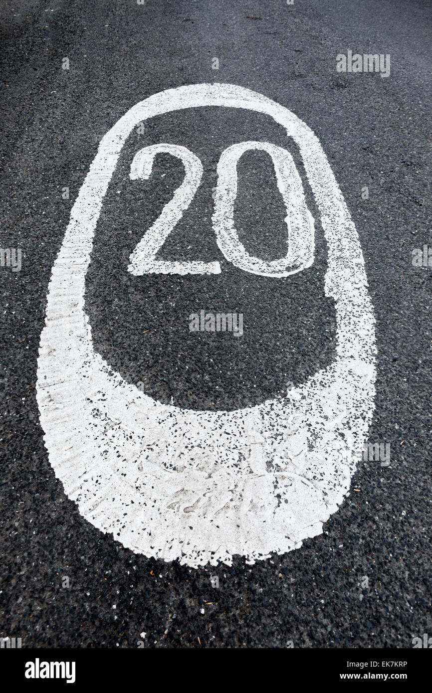 A 20mph speed restriction painted on the road in white paint. Glasgow, Scotland, UK Stock Photo