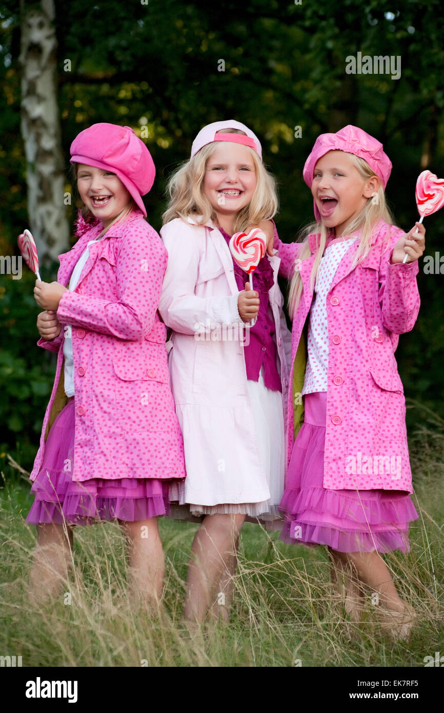 3 pink jacked sisters Stock Photo