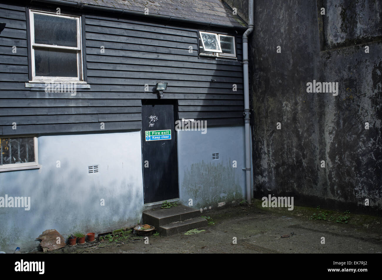 A fire exit at the back of a building Stock Photo