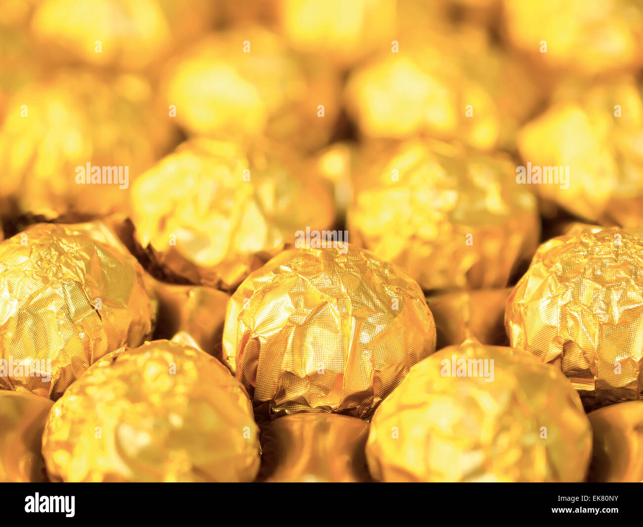 Candy In Gold Wrappers Stock Photo Alamy