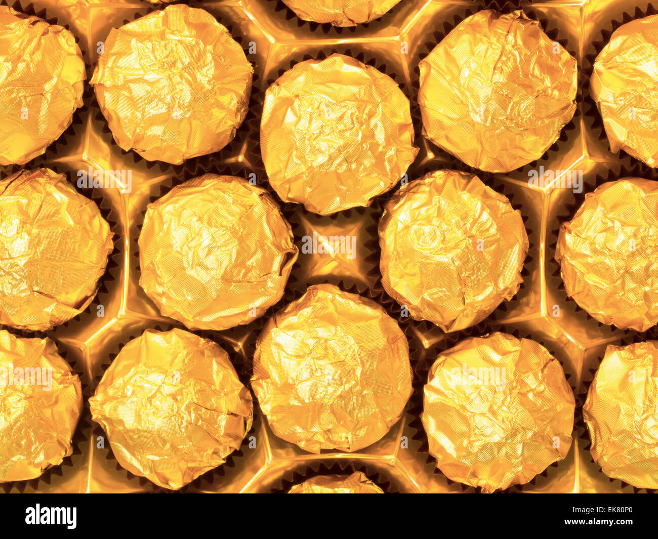 candy in gold wrappers Stock Photo Alamy